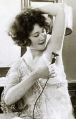 woman-using-an-electric-razor-1929.jpg